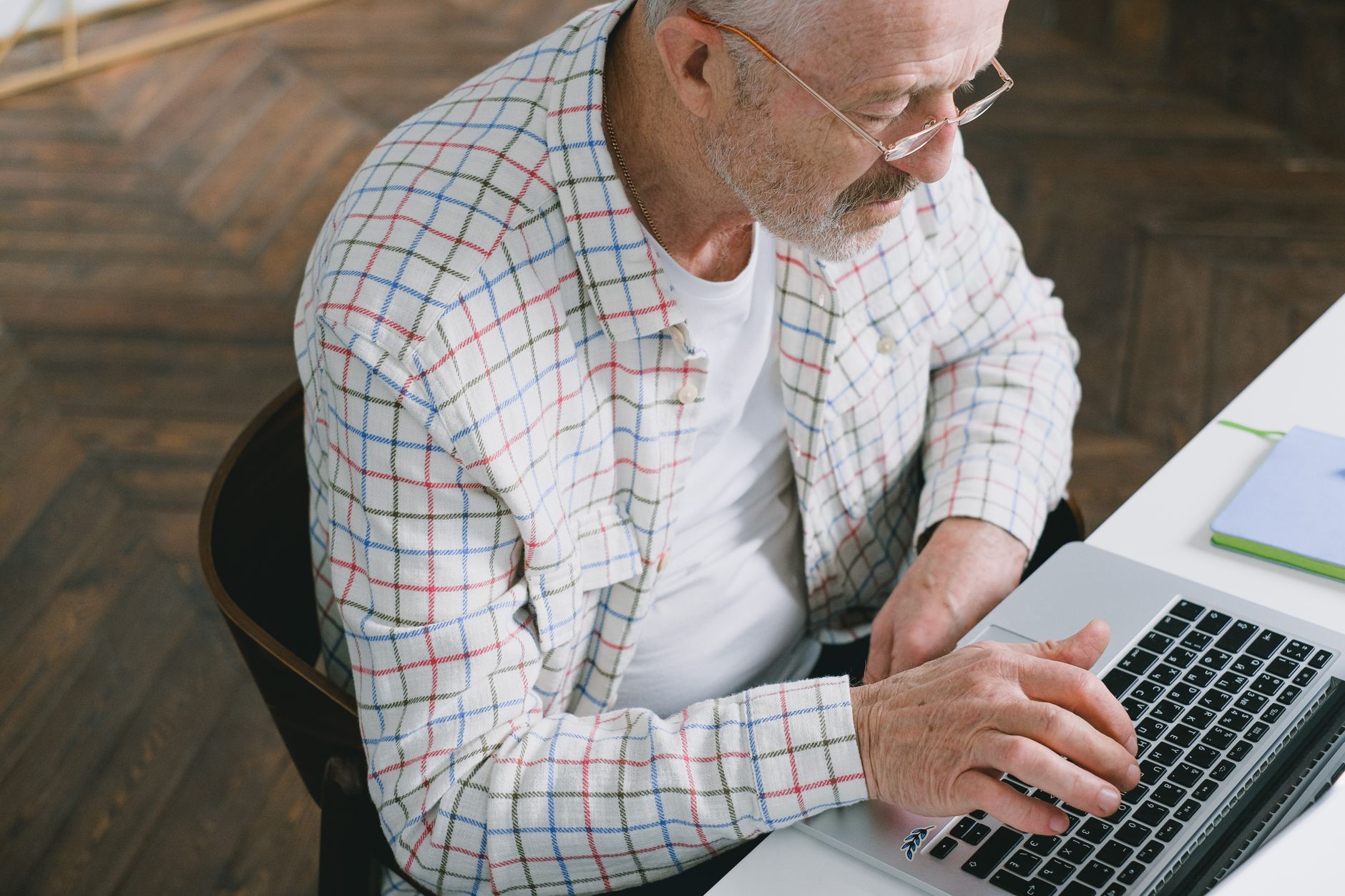 An older adult comparing Medicare plan options online