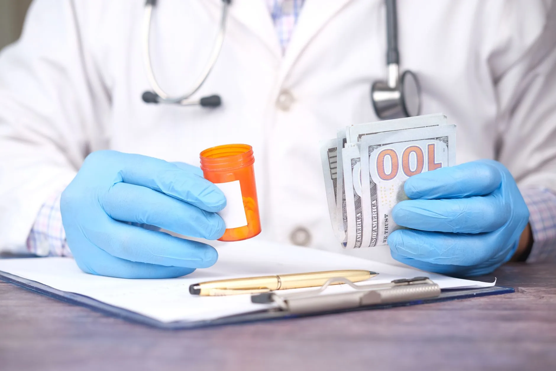 A stethoscope resting on cash, representing rising 2026 ACA health insurance premiums
