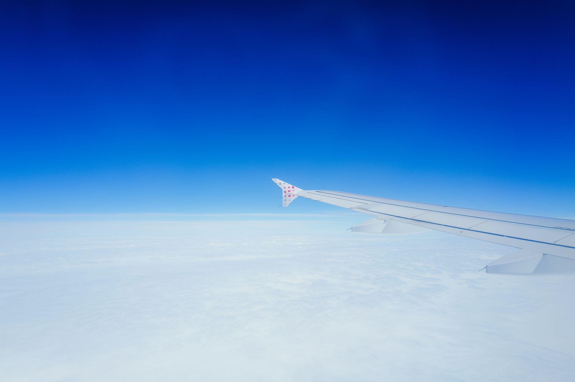 An airplane in flight above the clouds