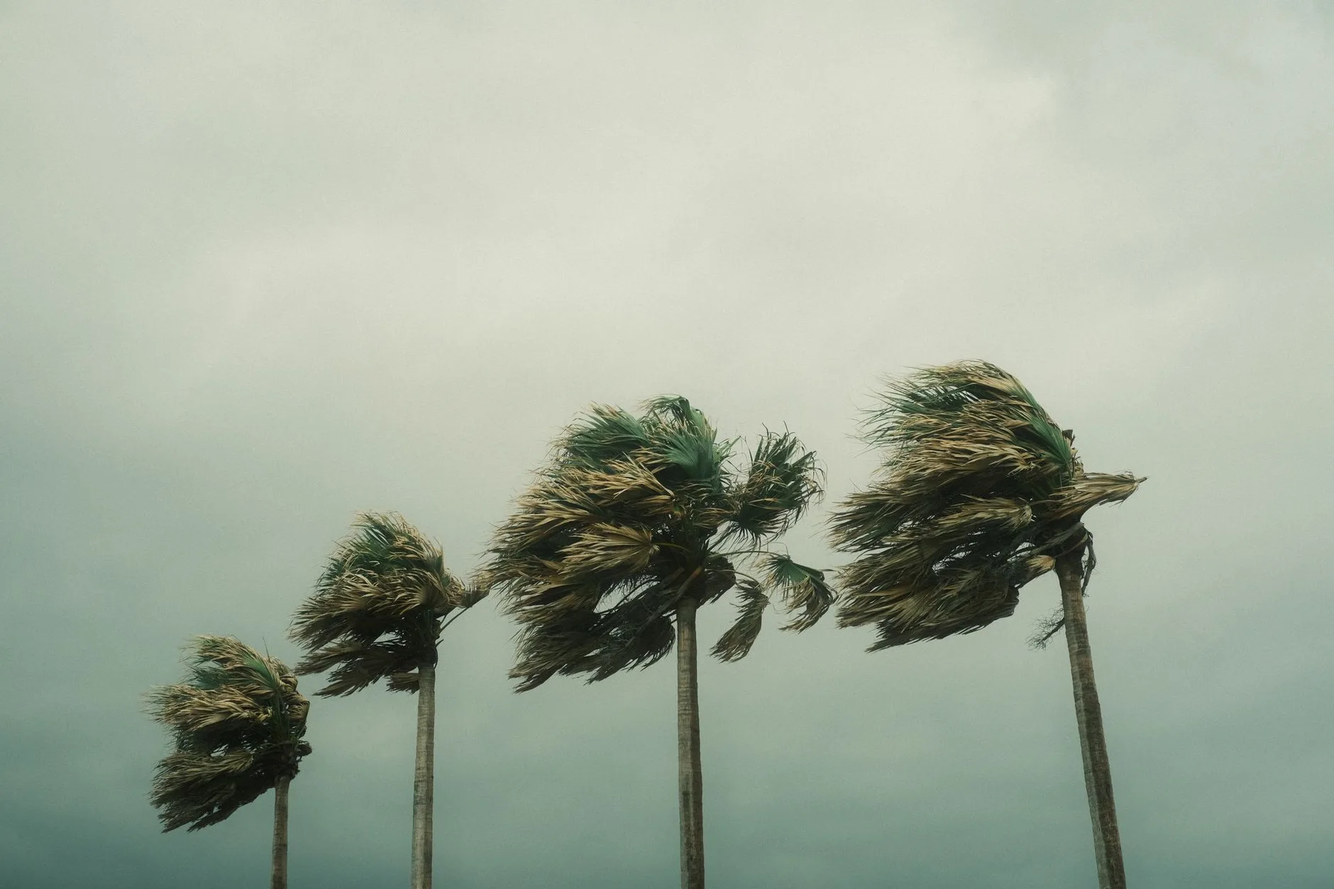 A storm system moving in over the water off the South Florida coast